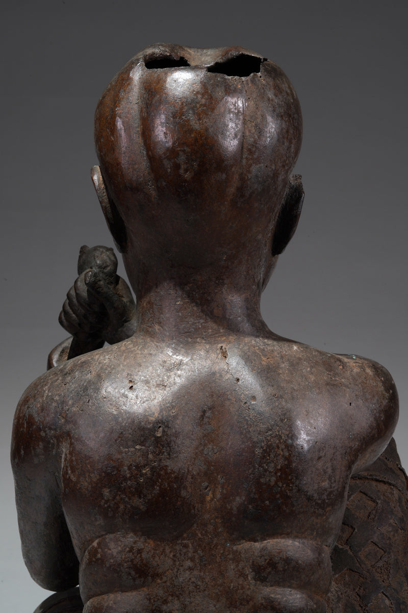An Ife style bronze of the seated figure of Tada