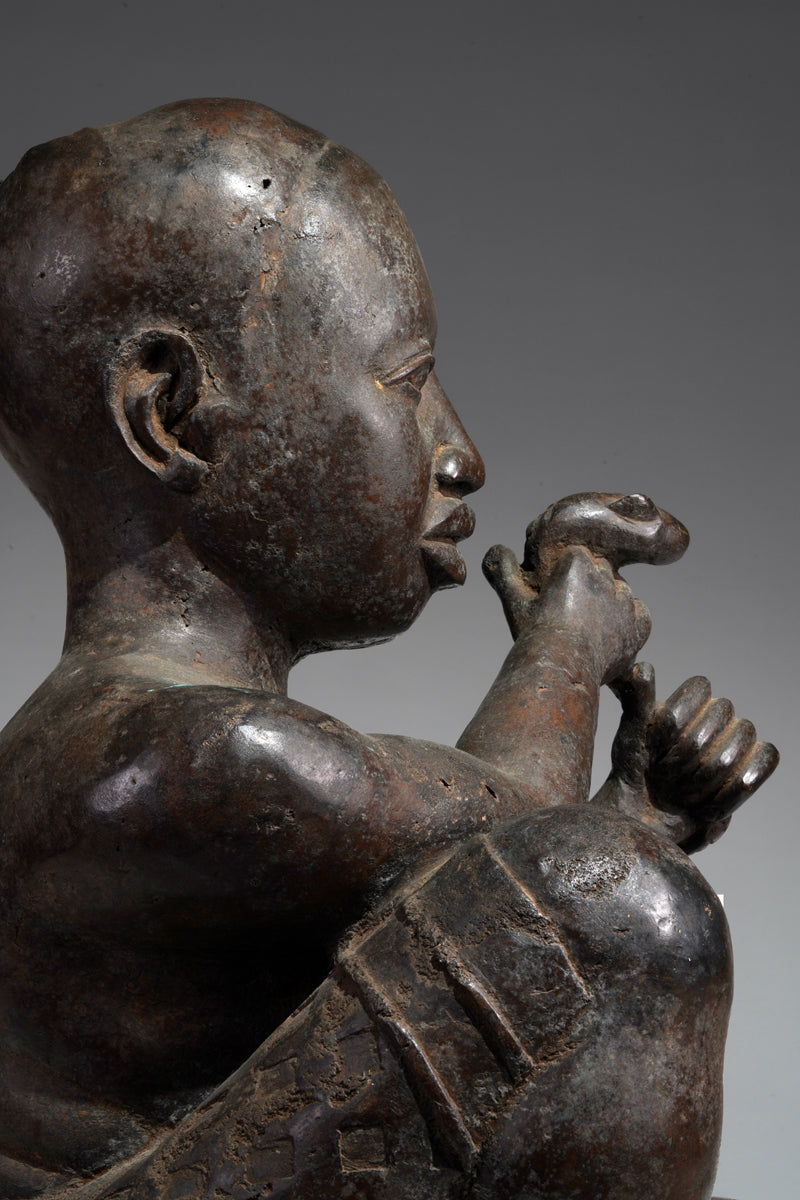 An Ife style bronze of the seated figure of Tada