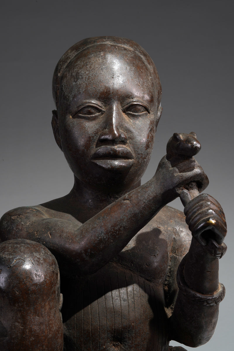 An Ife style bronze of the seated figure of Tada