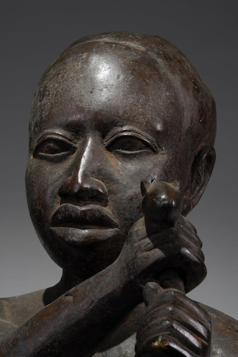 An Ife style bronze of the seated figure of Tada