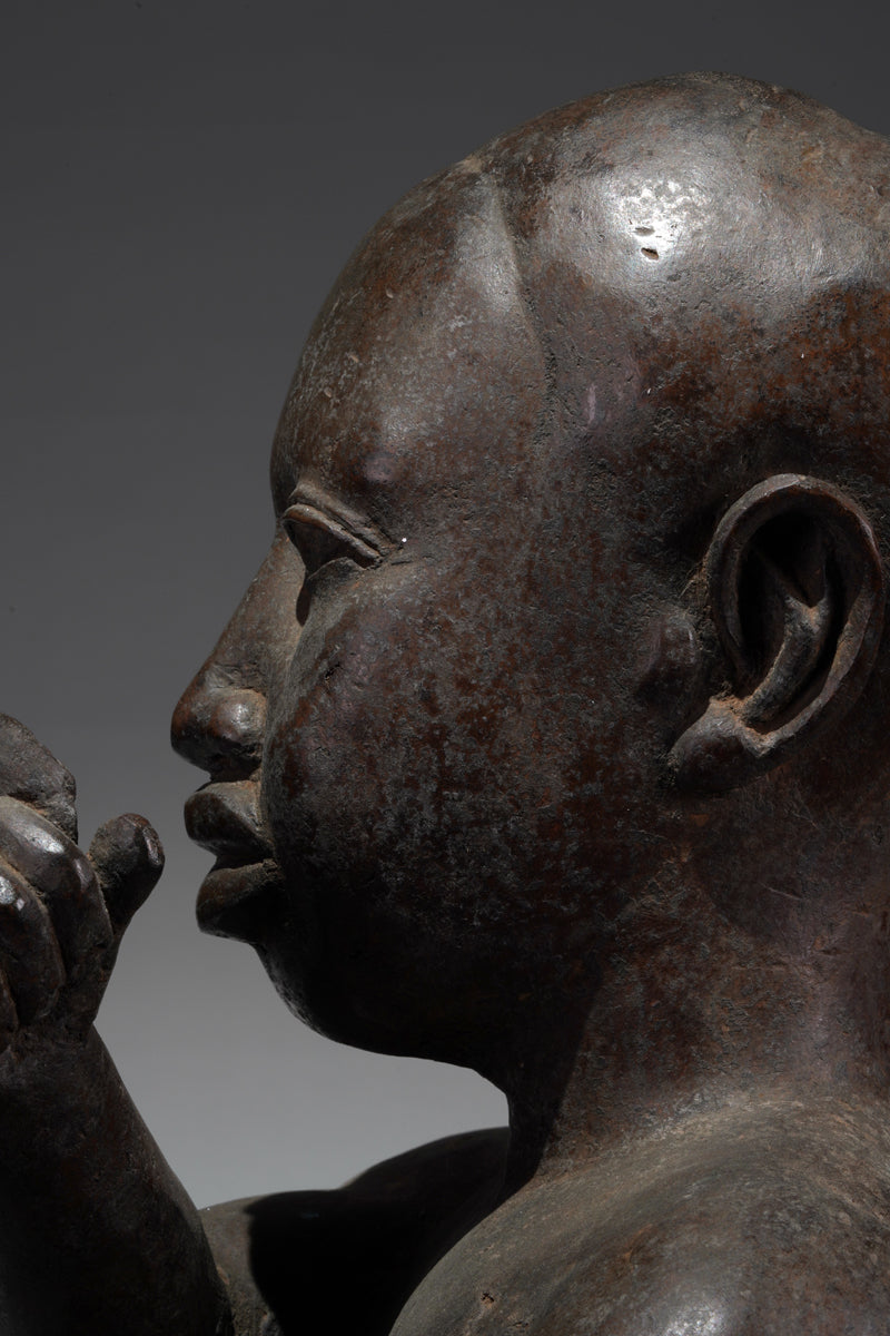 An Ife style bronze of the seated figure of Tada