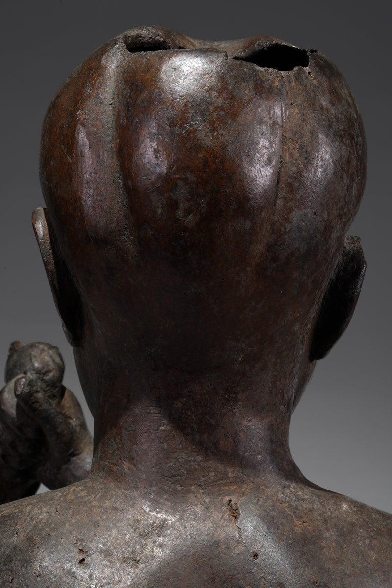 An Ife style bronze of the seated figure of Tada