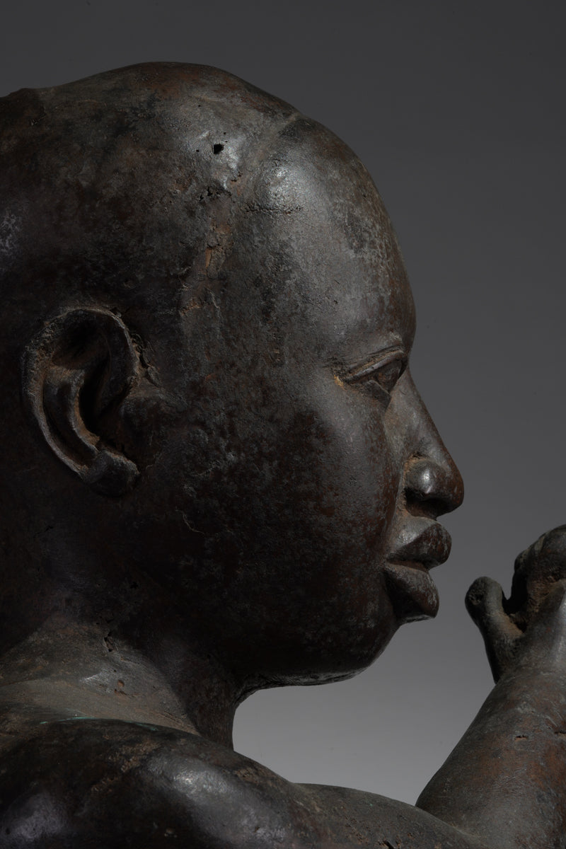 An Ife style bronze of the seated figure of Tada