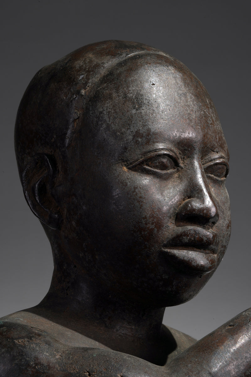 An Ife style bronze of the seated figure of Tada