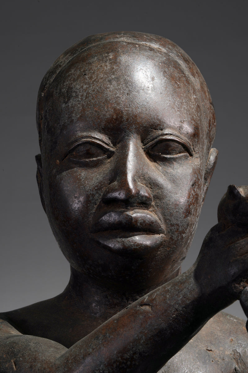 An Ife style bronze of the seated figure of Tada