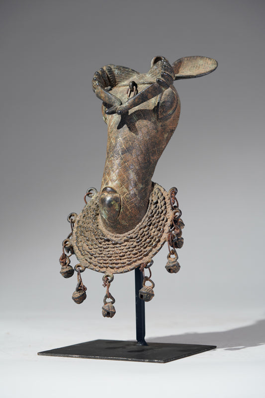 The present s bronze ram head