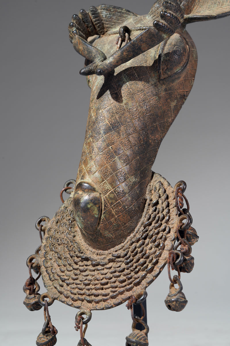The present s bronze ram head