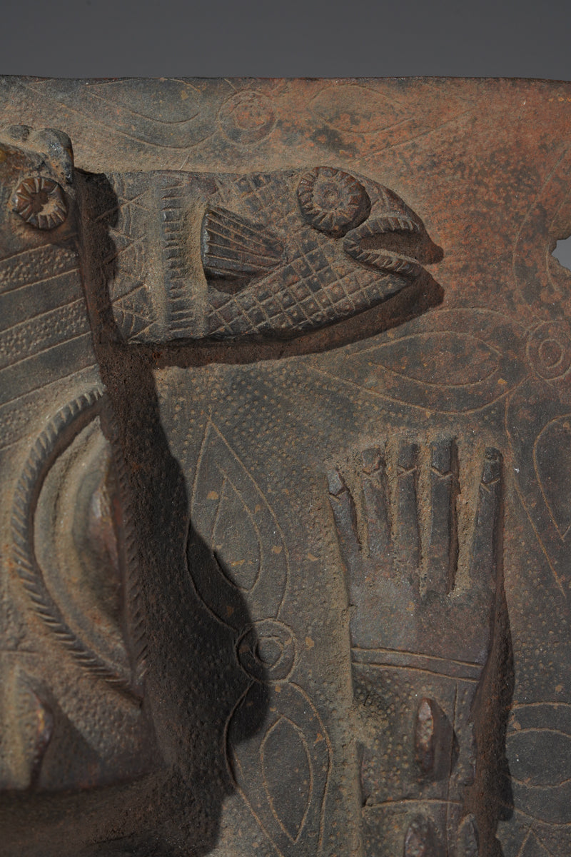 This fragmentary Benin Bronze plate