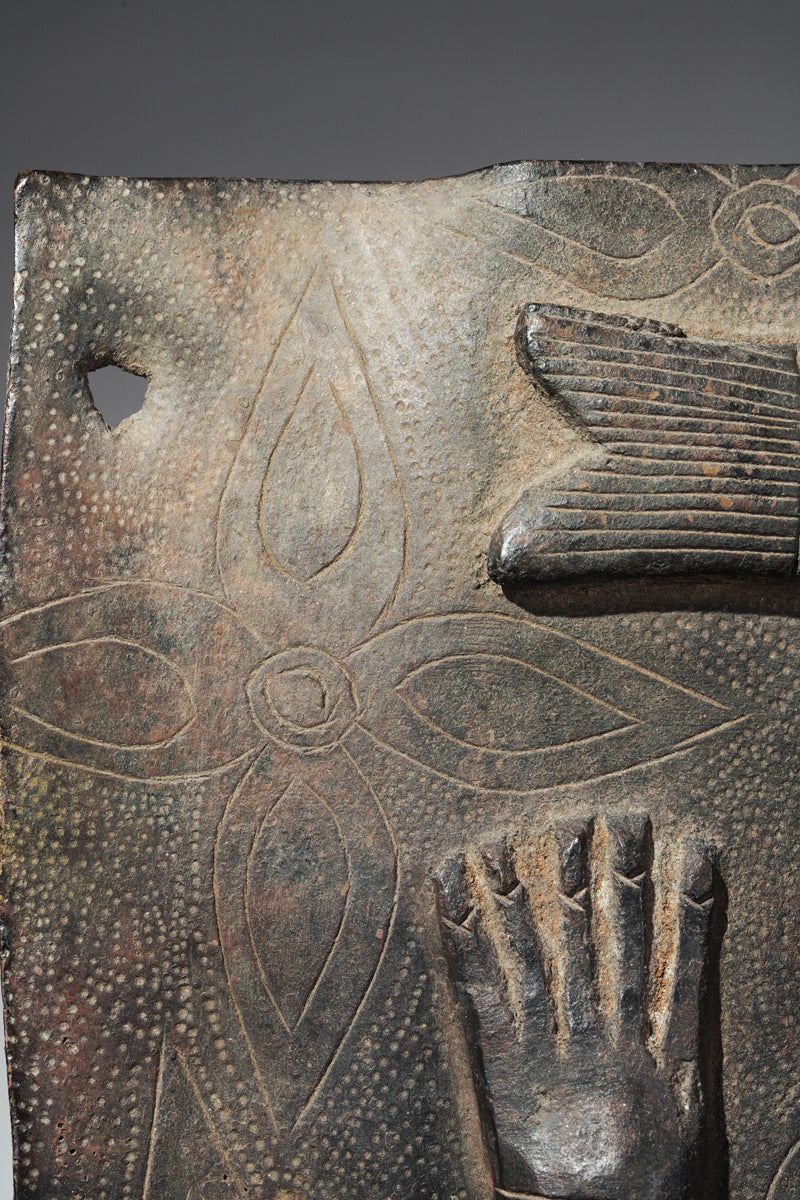 This fragmentary Benin Bronze plate