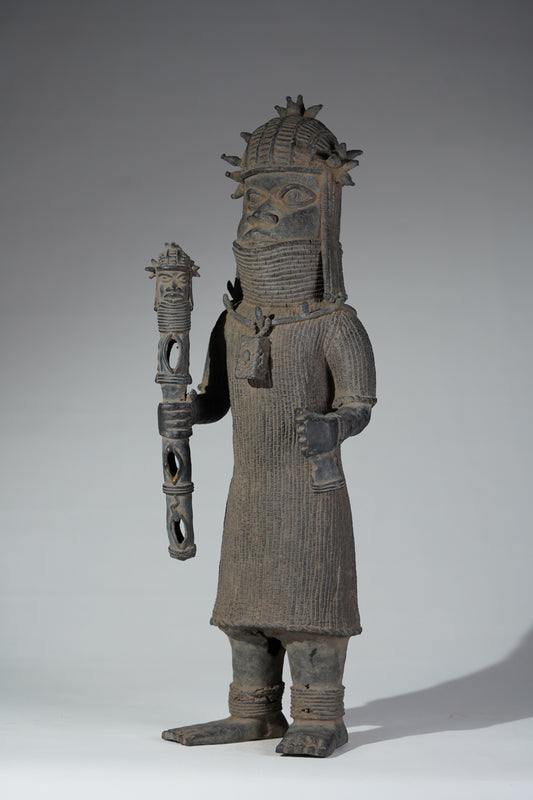 This cast brass figure of an Oba