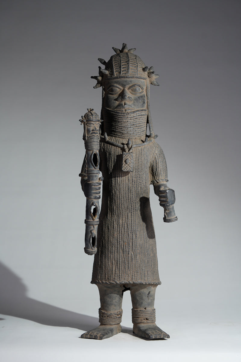 This cast brass figure of an Oba