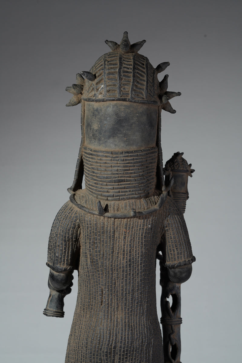 This cast brass figure of an Oba