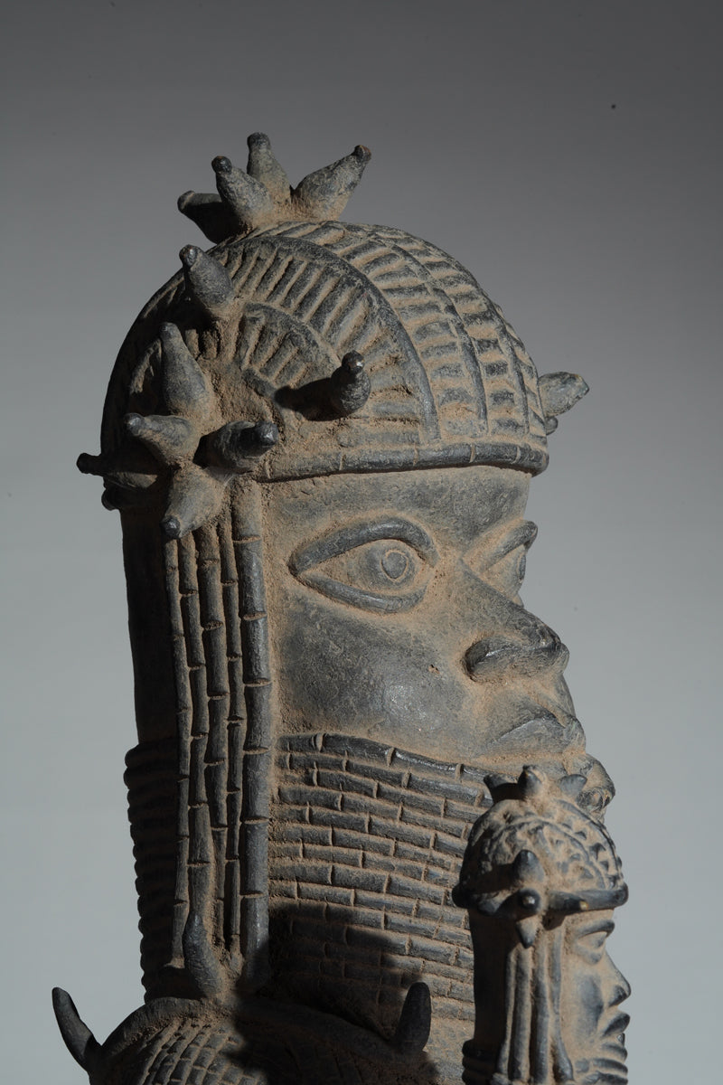 This cast brass figure of an Oba