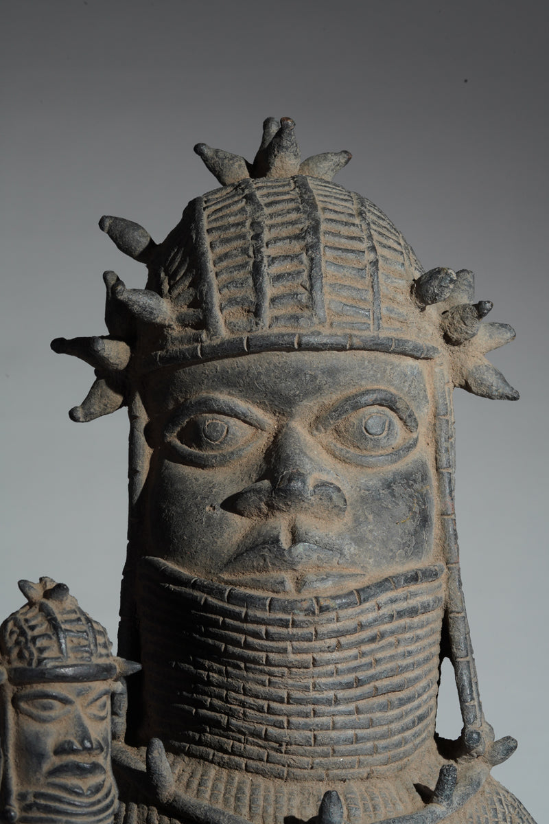 This cast brass figure of an Oba