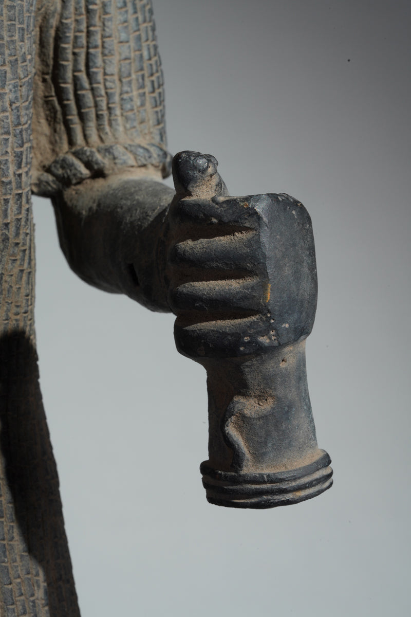 This cast brass figure of an Oba