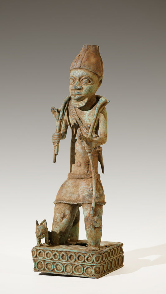 A Benin Bronze of a hunter in Tada style