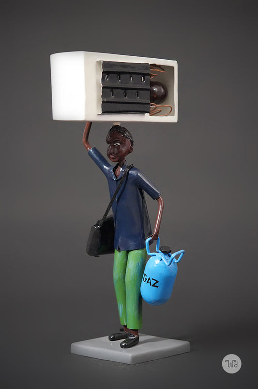 A Mechanic with a Fridge, Tools, and Gas Bottle