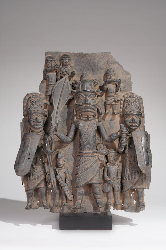 A Benin plate with eight persons