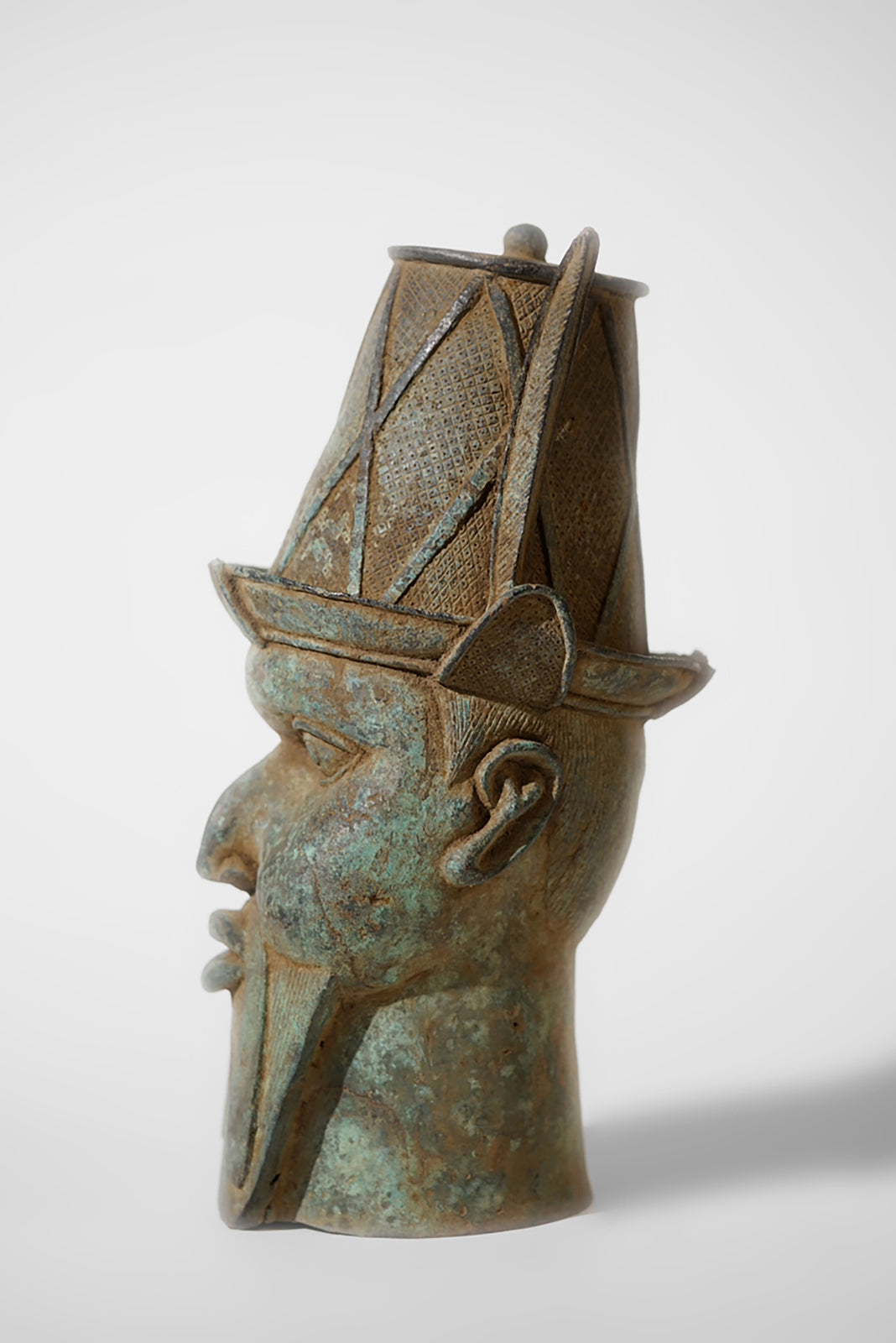 A Benin Bronze Head of a Portuguese