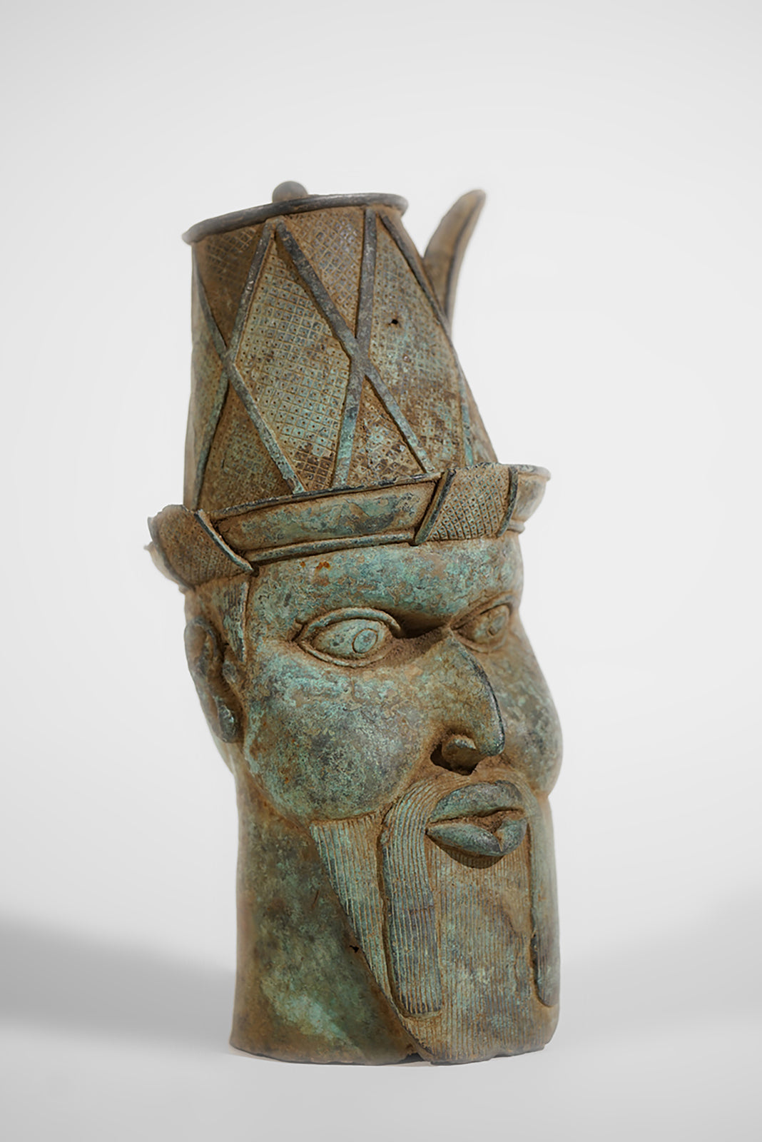 A Benin Bronze Head of a Portuguese