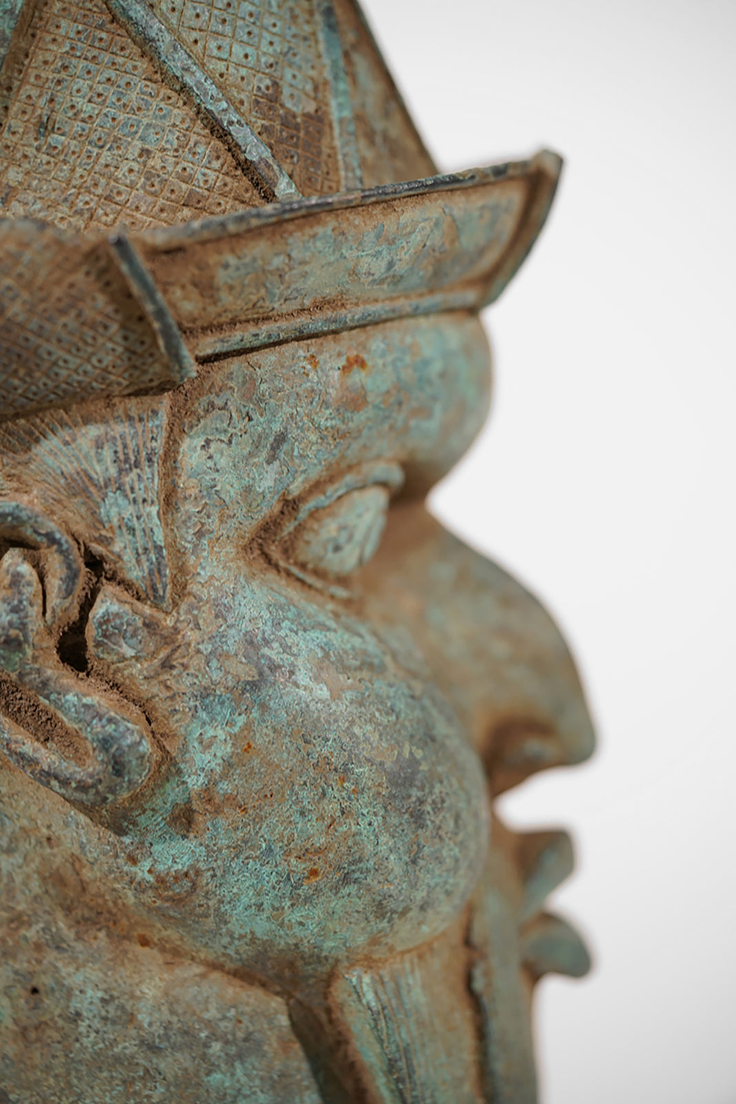 A Benin Bronze Head of a Portuguese
