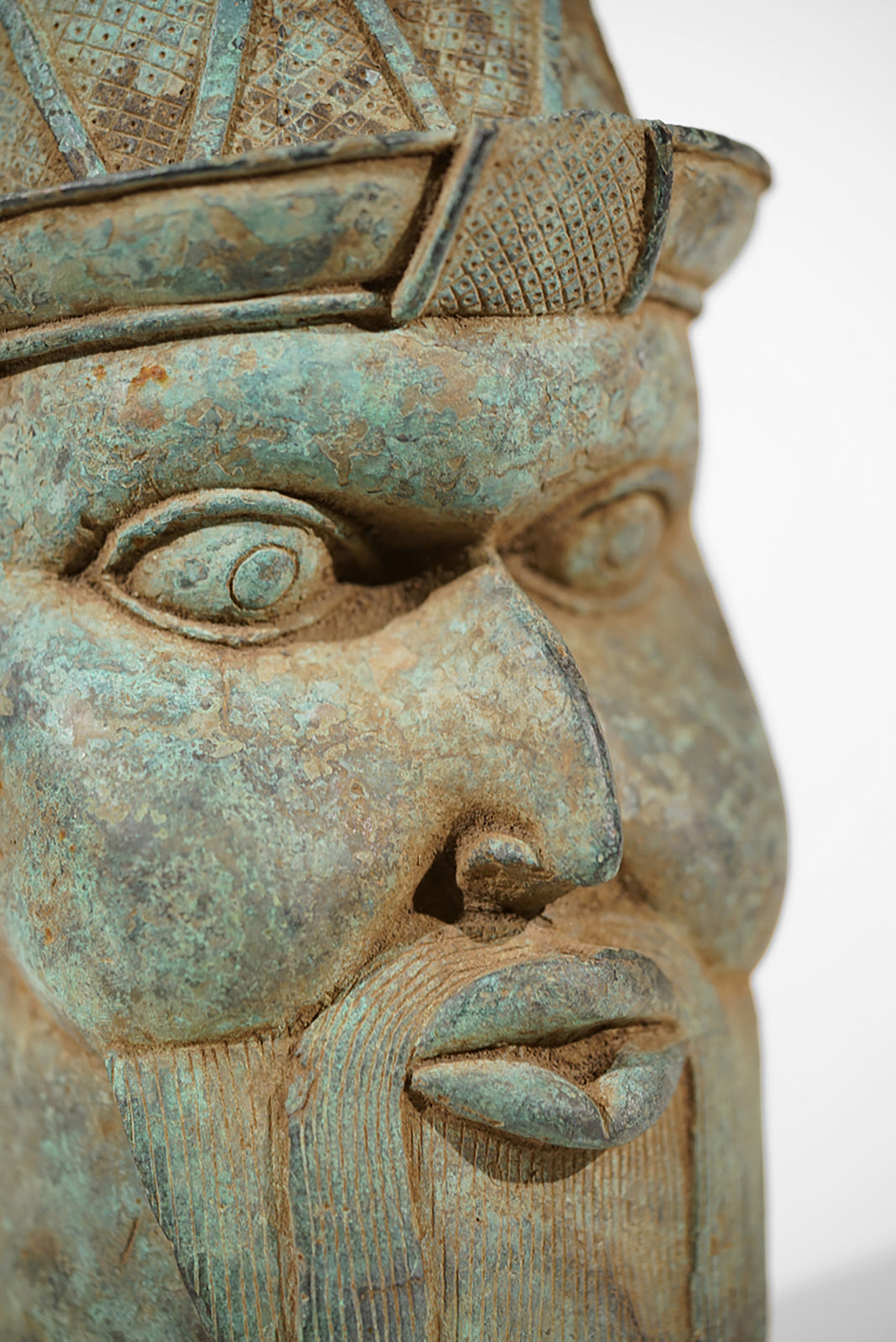 A Benin Bronze Head of a Portuguese