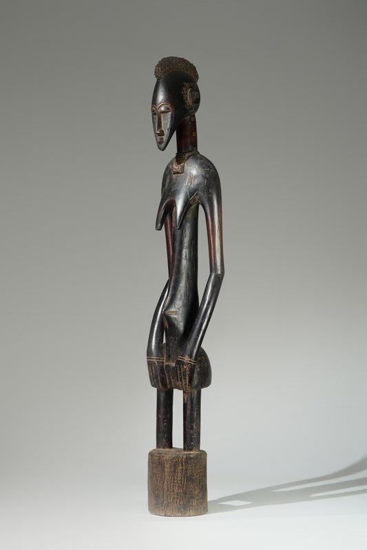 A female Senufo Rhythmpounder (Déblé)