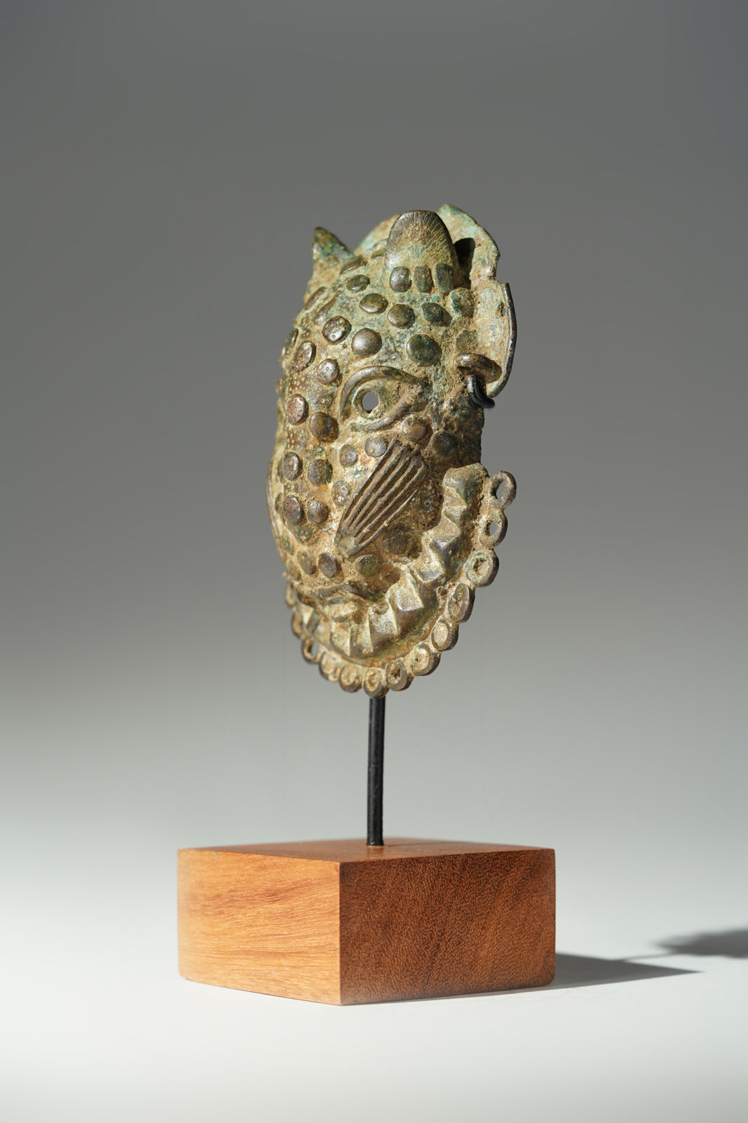 A Benin Bronze hip mask