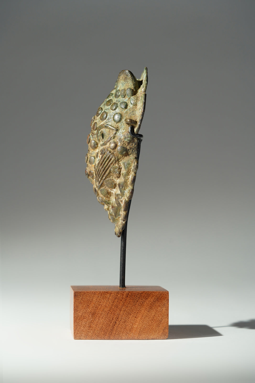 A Benin Bronze hip mask
