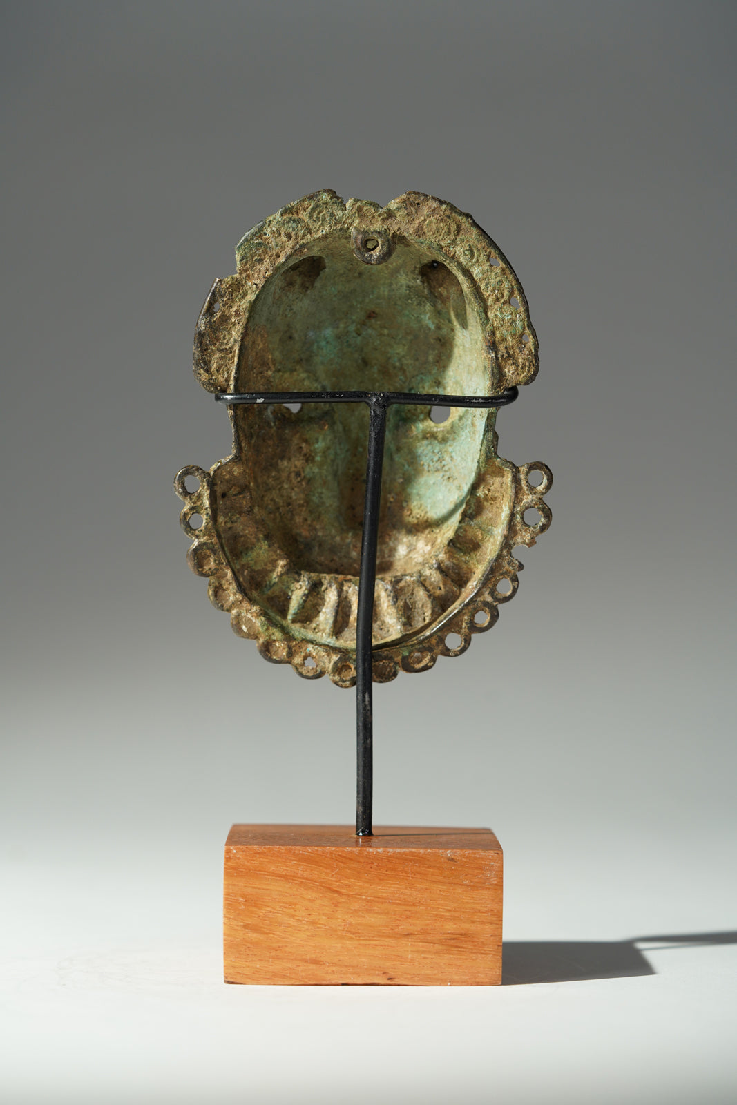 A Benin Bronze hip mask