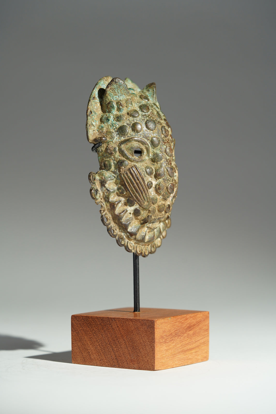 A Benin Bronze hip mask