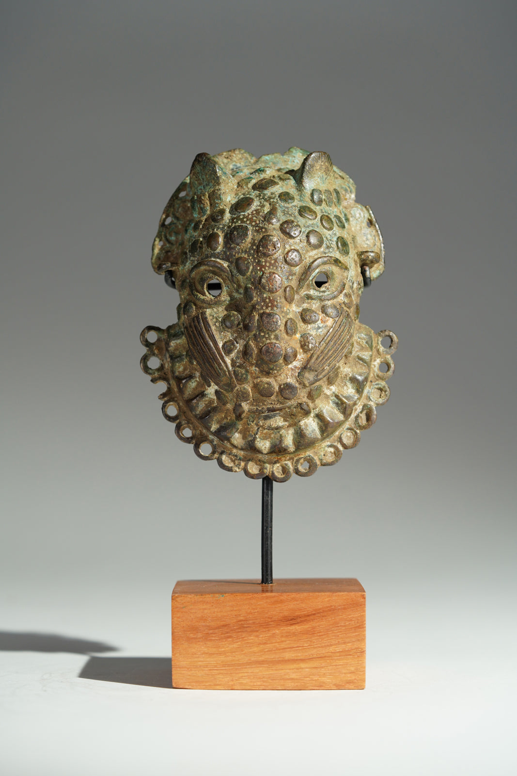 A Benin Bronze hip mask