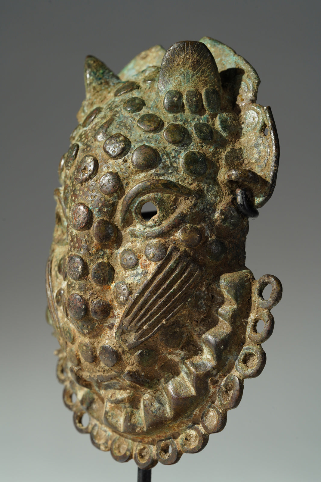 A Benin Bronze hip mask