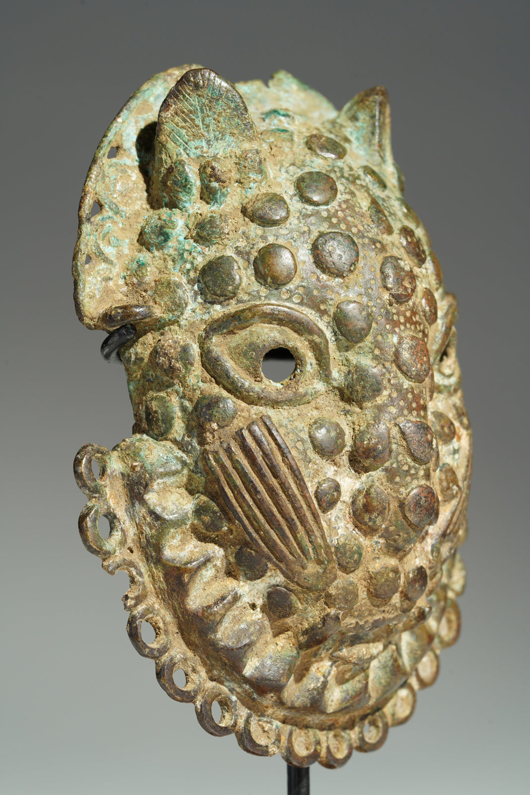A Benin Bronze hip mask
