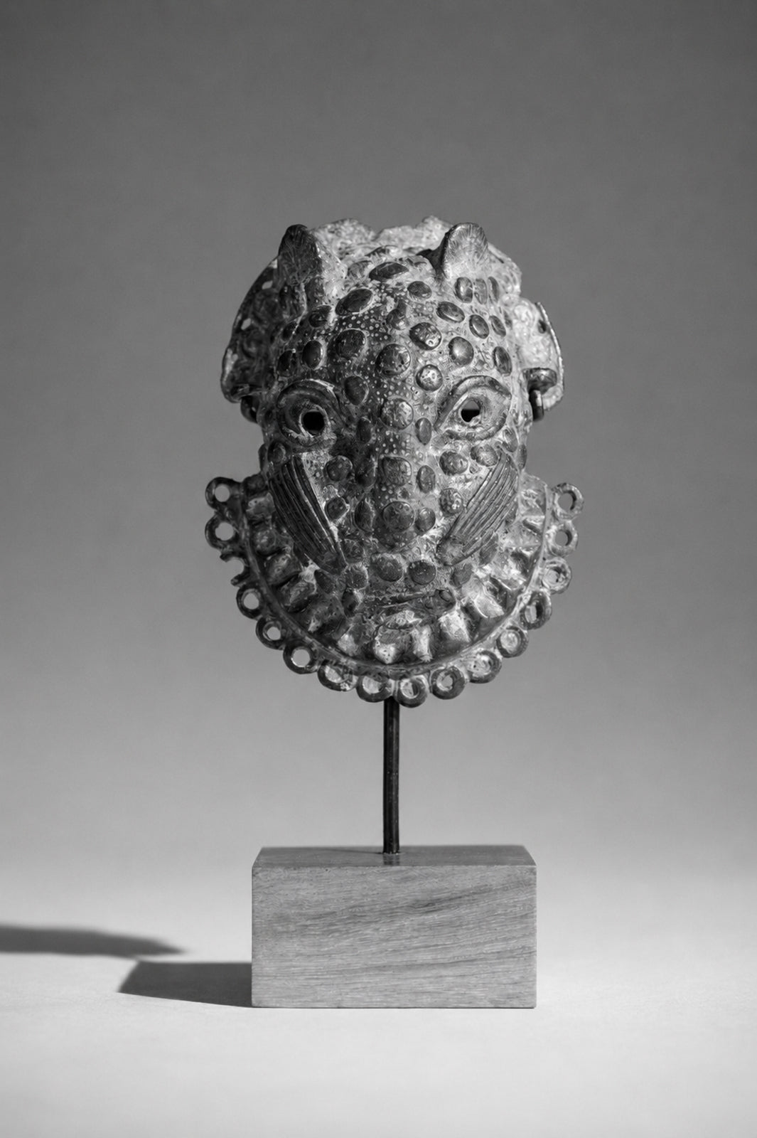 A Benin Bronze hip mask