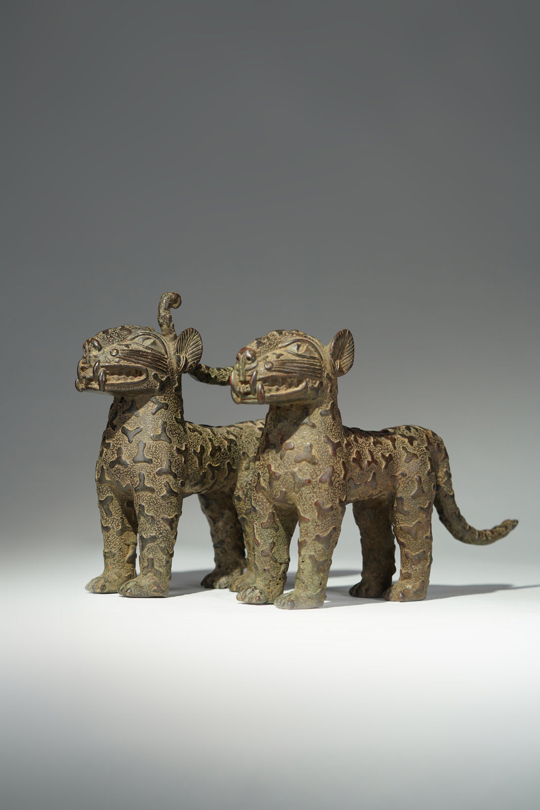 A couple bronze leopards