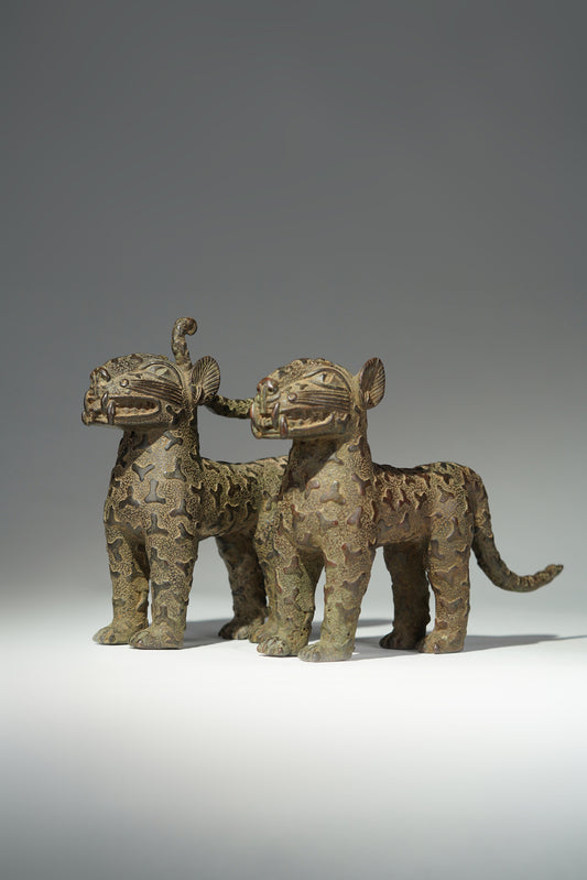 A couple bronze leopards