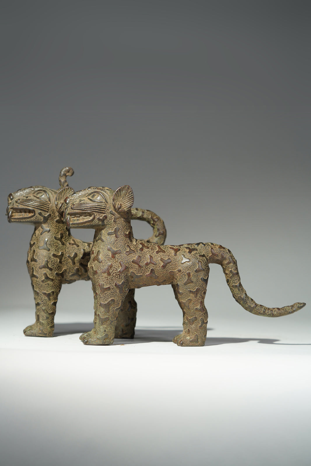 A couple bronze leopards