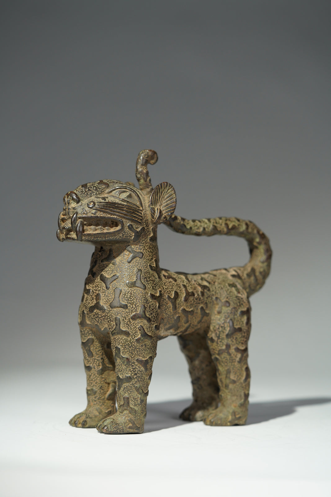 A couple bronze leopards