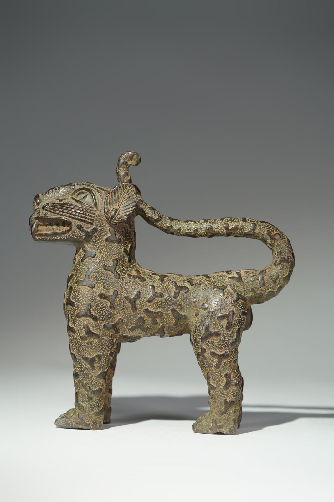 A couple bronze leopards