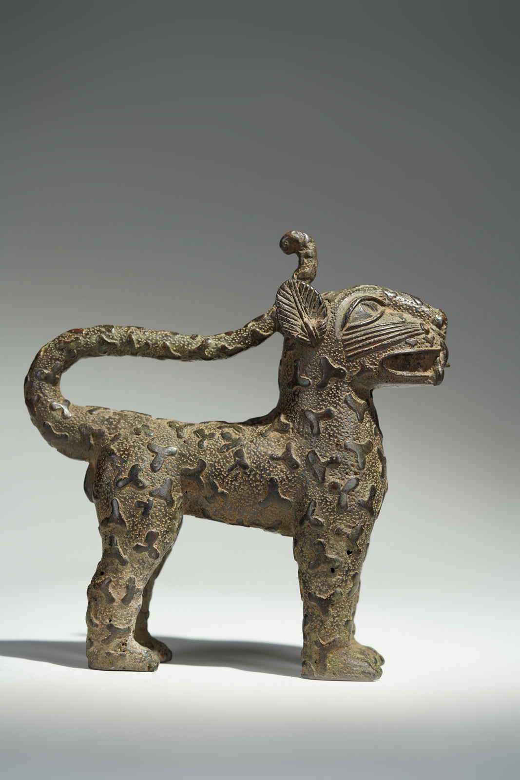 A couple bronze leopards