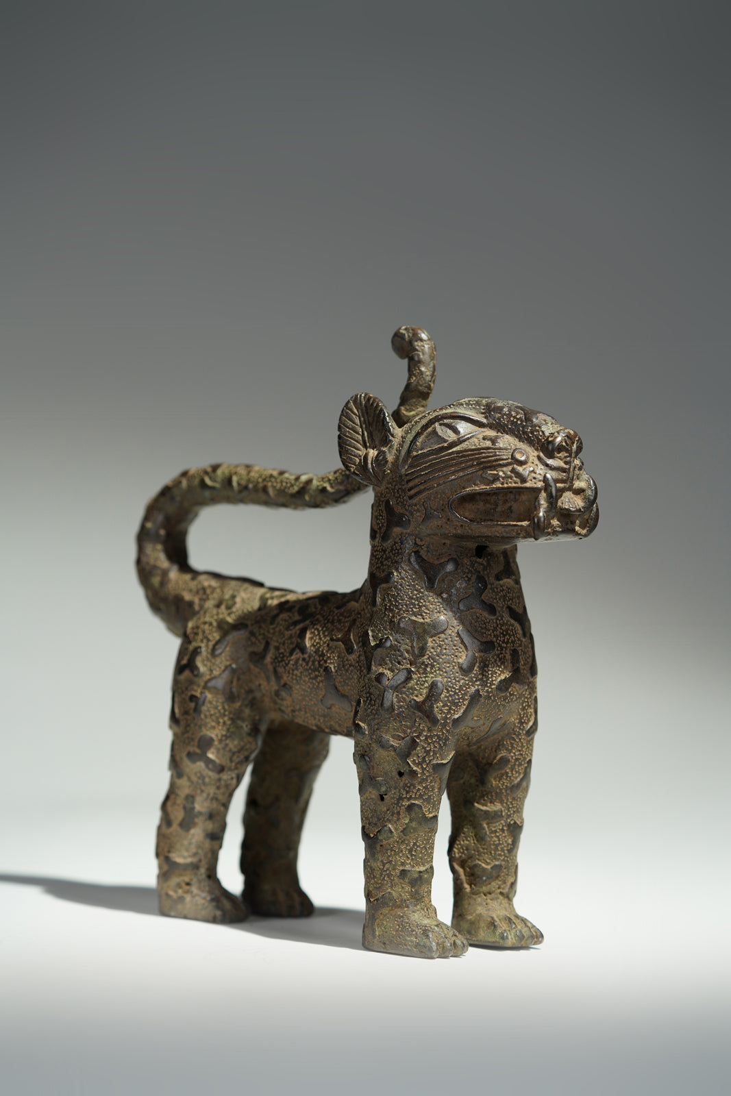 A couple bronze leopards