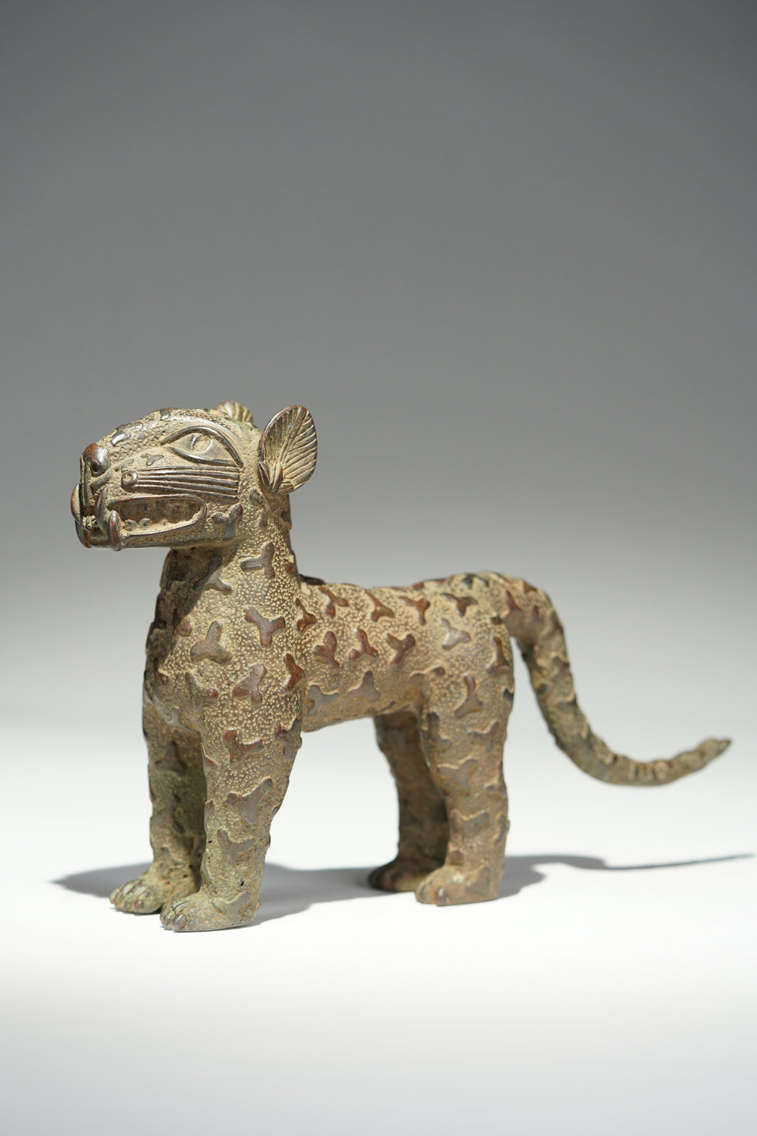A couple bronze leopards