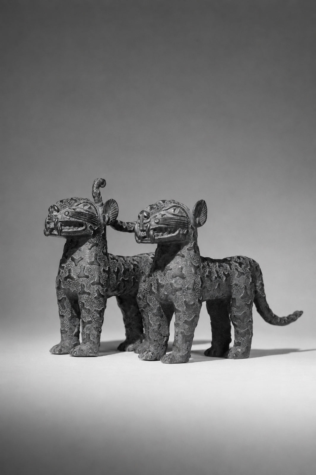 A couple bronze leopards
