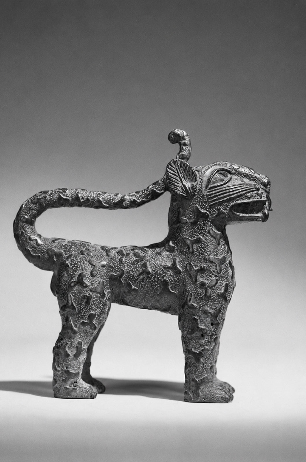 A couple bronze leopards