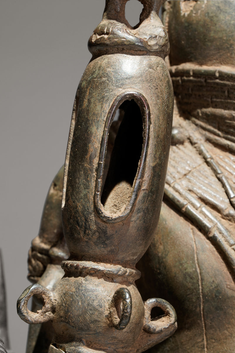 A bronze statue of an Oba in the Benin style