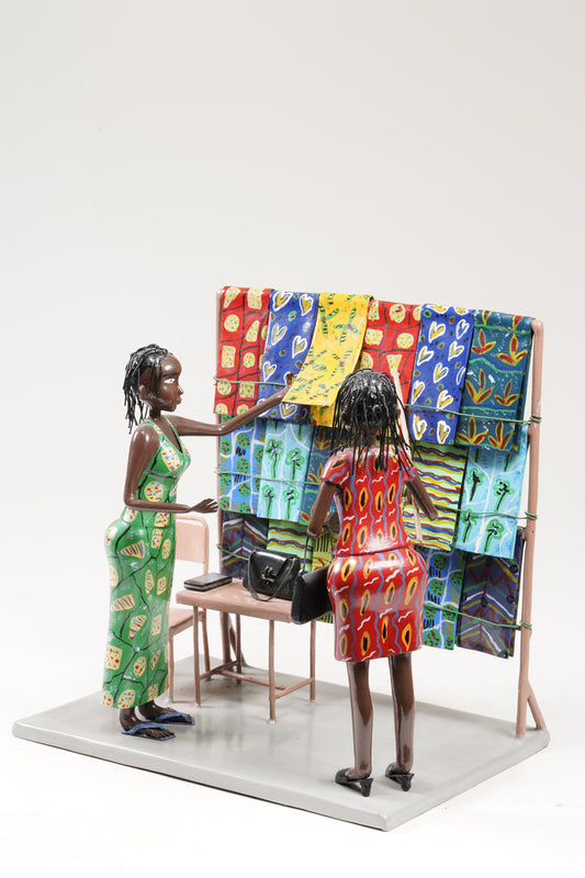 Two women dressed in typical African textiles