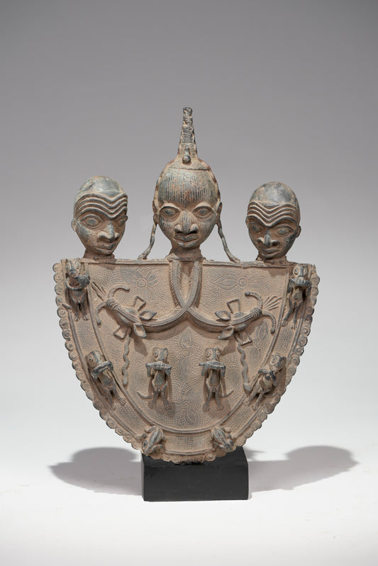 A Bronze Plaque in the style of Benin/ Ife