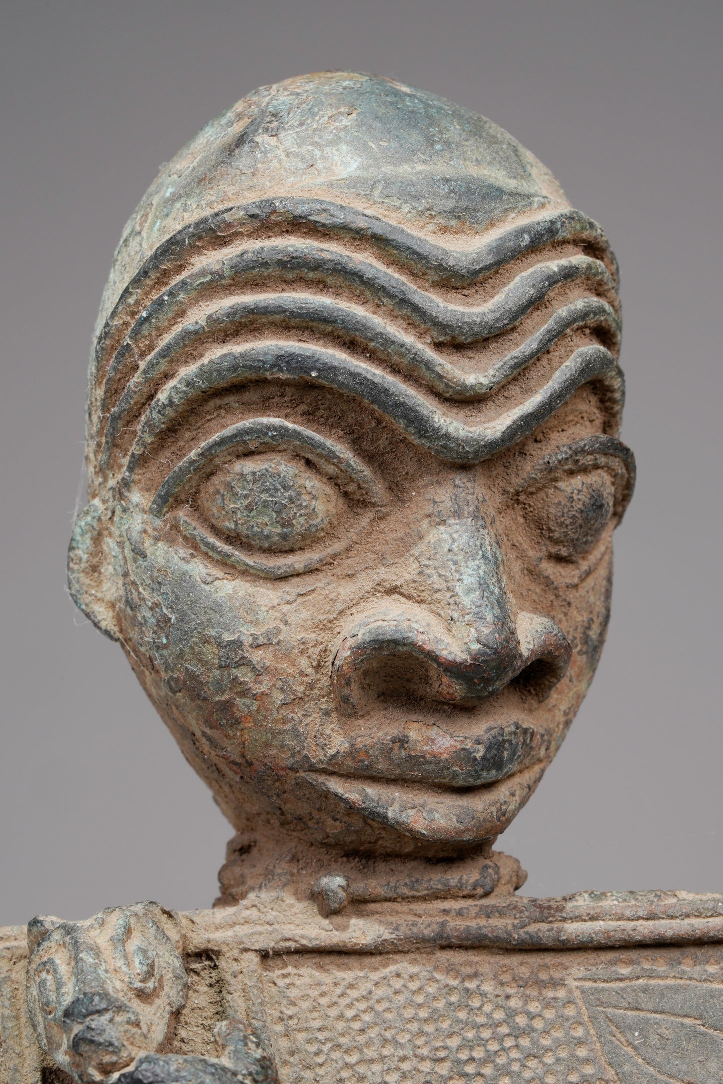 A Bronze Plaque in the style of Benin/ Ife
