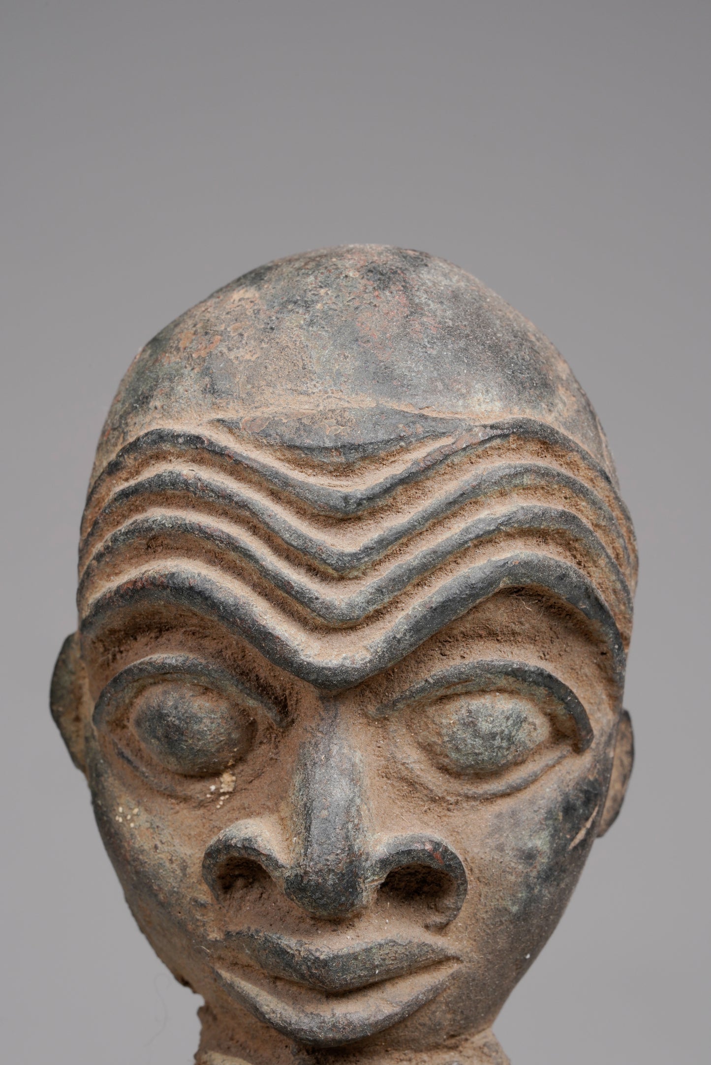 A Bronze Plaque in the style of Benin/ Ife